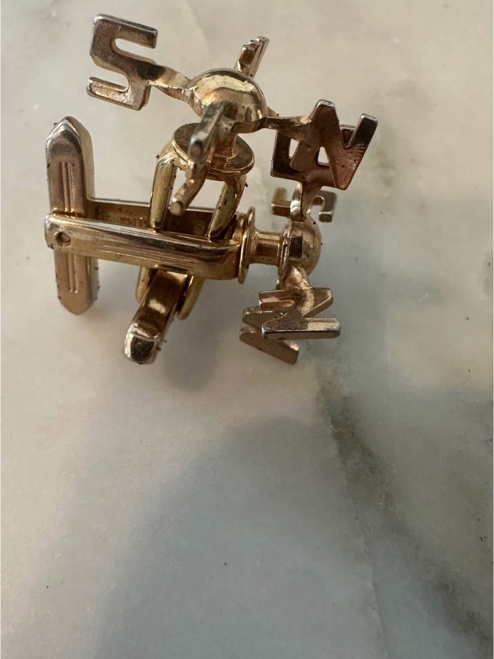 Gold-tone N  S E W cufflinks